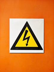 Wall Mural - warning, sign and voltage with triangle or symbol for alert, precaution or safety at warehouse or fa
