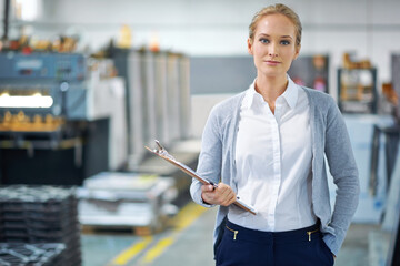 Wall Mural - Woman, clipboard and factory in portrait for logistics with quality assurance in facility for inventory. Confident female person, checklist and manufacturing with storage, industry and distribution