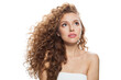© artmim - Nice young woman with natural make-up, clear fresh skin and wavy hairstyle on white background