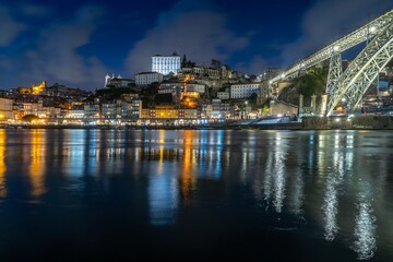 Wall Mural - Night skyline from the Dom Luis I bridge in Porto, Portugal, on the banks of the Douro river, cityscape at night.