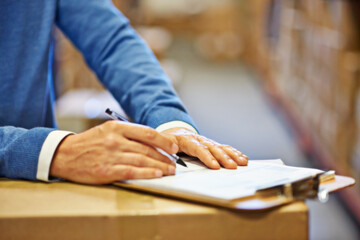 Poster - Hand, writing and inspector with closeup of clipboard in warehouse for inventory, quality control or freight distribution. Logistics, man or wholesale supplier with stock checklist for box inspection
