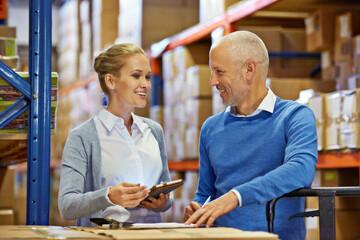 Poster - Teamwork, collaboration and employees at warehouse for logistics, inventory and discussion in meeting for ecommerce industry. Workers, man and woman with cargo, stock and technology for shipping