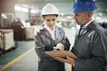 Poster - Man, woman and checklist with clipboard in factory for quality inspection or safety checks and process monitoring. Team, communication and board for manufacturing information in printing warehouse.