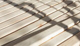 Fototapeta Dziecięca - Wooden beams in a row on a sunny day. Construction and repair. Close-up. Space for text. Background.