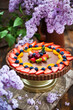 Delicious homemade chocolate tart decorated with fresh strawberry, blueberry, apricot and cherry