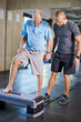 © peopleimages.com - Physiotherapist, helping and senior man with cardio, training and elderly support for care. Men, gym and exercise for health, wellness and coaching with aerobic step for mature rehab and wellbeing