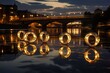 Riverside Reflections: Rings on a riverbank with reflections of city lights.