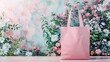 pink tote bag on a table mockup, floral background