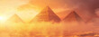 A panoramic view of the Pyramids in Egypt at sunset, with golden hues painting the sky and sand dunes