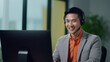 Jubilant Asian Businessman Smiling with Headphones in Call Center Generative AI