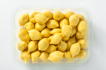 Wall Mural - uncooked Italian gnocchi on a white background