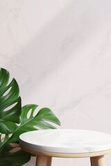 Wall Mural - White marble table and tropical plant on plain wall background