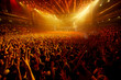 © Fernando Cortés - Electric atmosphere: Packed concert hall with ecstatic fans dancing and cheering, stage in full view