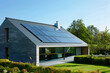 Large modern house with a large roof on which solar panels are installed to generate electricity