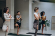 © sashafolly - Group of people standing balancing on mats in yoga studio
