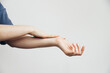 © vladdeep - Beautiful Woman Applying Cosmetics on Hands, Lotion. Spa and Manicure concept, plain background