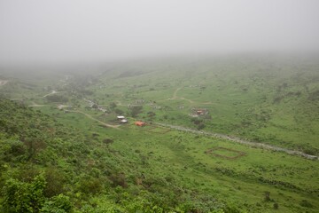 Stunning landscape featuring lush green field during cloudy weather