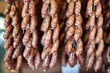 overhead shot of sausages hanging in a symmetric pattern