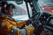African American female truck driver resting in his truck, he is using tablet and having video call to his family. She is on the snowy roads of Alaska.