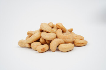 Pile of tasty roasted cashew nuts isolated background isolated background