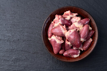 Poster - Raw chicken giblets hearts , meat background