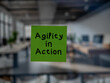 Post note on glass with 'Agility in Action'.