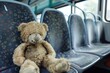 © studioworkstock - grubby teddy bear left on empty bus seat