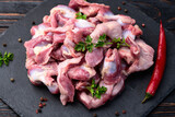 Fototapeta Panele - Raw chicken giblets gizzard ( stomach ) , meat background