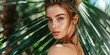 portrait of a beautiful girl against a background of tropical plants, palm leaves, spa concept, beauty and cosmetology, travel and beach holidays