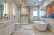 Modern bathroom with large soaking tub and glass shower enclosure