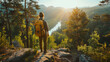 A traveler with a backpack standing on a rocky overlook, watching a river in the forest at sunset.
