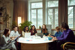 © master1305 - Group of young people sitting at the table, student studying with laptops and papers together on library on daytime. Concept of education, youth, knowledge, homework, exams, projects.