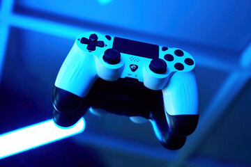 Gamepad on abstract background with light effects