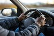 © studioworkstock - closeup of a driver gripping the steering wheel