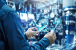 © pilipphoto - Industry engineer in factory using smart tablet device to control networking for auto industry. Smart industry 4.0 technology concept