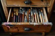 open drawer displaying various paintbrushes