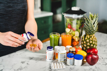 Woman taking food supplements instead of fresh fruits and vegetables. Dietary healthy eating, body slimming and losing weight. Medicine for burning fat and calories