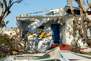 Poster - Property damage from strong hurricane winds. Mobile homes in Florida residential area with destroyed rooftops. Consequences of natural disaster