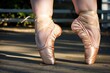 plussize dancers feet with taped toes in pointe shoes