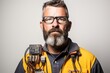 portrait of a male technician wearing glasses and a yellow safety vest