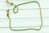 Fototapeta Lawenda - isolated rope mockup on mint green wooden background top view