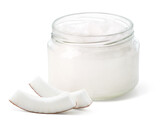 Fototapeta  - Glass jar of coconut oil and fresh coconut pieces on white background