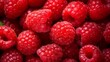 Closeup of red ripe raspberries. Natural vitamins and antioxidants. Healthy nutrition or raw food concept.