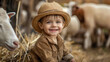 A happy kid aged 1- 2 years as farmer, with straw hat in a farm. Agriculture and farming concept.