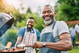 Fototapeta Most - African men grilling with his father in the garden of the house talking and laughing