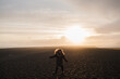 © anna_gorbenko - Traveling and exploring Iceland landscapes and travel destinations. Young female tourist enjoying the view and outdoor spectacular scenery. Summer tourism by Atlantic ocean and mountains.