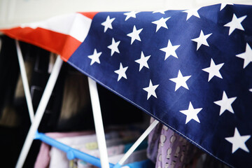 Wall Mural - Flapping flag USA with wave. American flag for Memorial Day or 4th of July. Closeup of American flag dark background