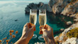Romantic couple clinking champagne glasses celebrating in tropical coastline cliff, tropical shallow waters and rocks in background, evening sunlight brings warmth