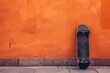 a skateboard leaning against a wall