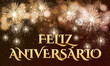 © emmanuel - cartão ou banner para desejar feliz aniversário em ouro sobre fundo marrom e preto com fogos de artifício dourados
